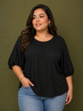 Blusa negra manga bombacha